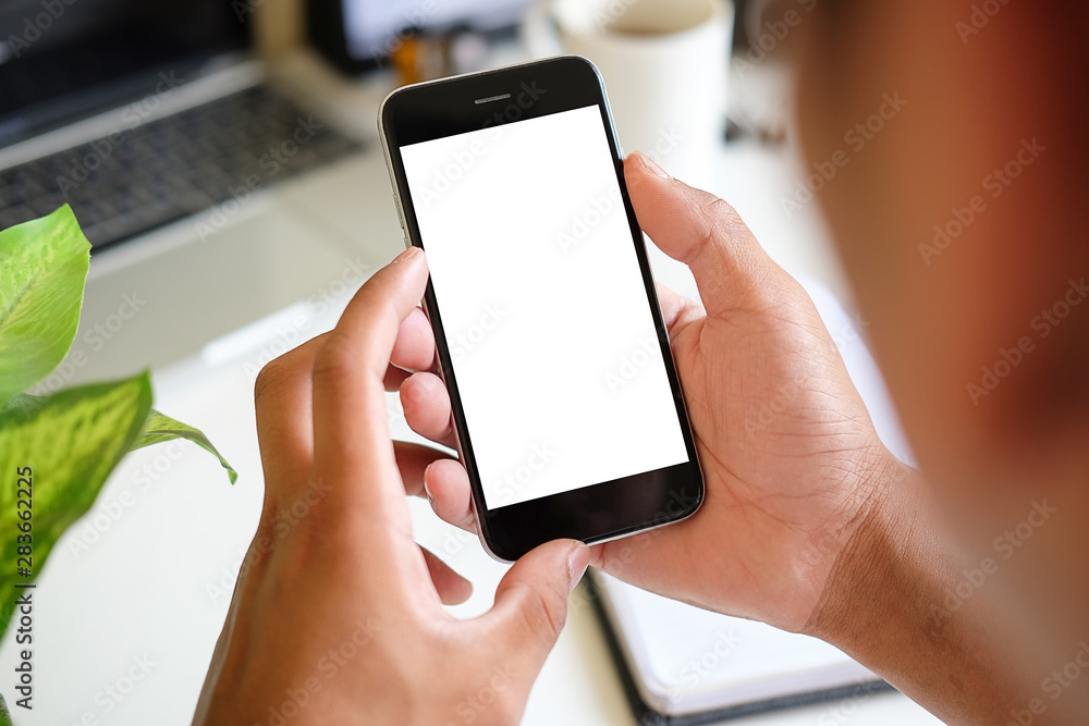 Poster cropped shot view of man hands holding smart phone with blank copy space screen for your text messag