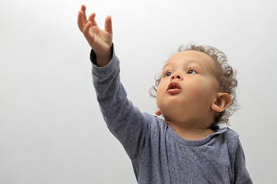 boy reaching for to the sky stock image on white background stock photo 