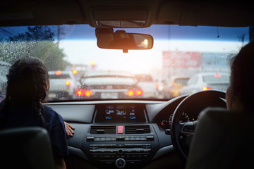 Women driving in the city. and driving car from rear view on the highway. 