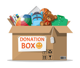 Cardboard donation box full of toys, books, clothes and devices. Help for children, support for poor kid. Social care, volunteering and charity concept. Vector illustration in flat style