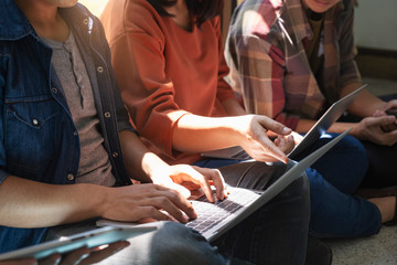 Teen group using computer and tablet to learning online.