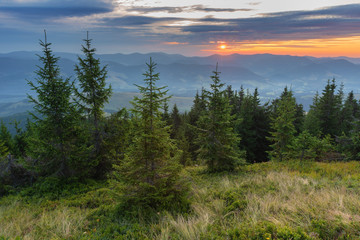 Fantastic starry night with galaxy Milky Way with a tourist and a tent on the mountain range in the Ukrainian Carpathians	