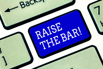 Handwriting text Raise The Bar. Concept meaning Set higher standards challenges seeking for excellence Keyboard key Intention to create computer message pressing keypad idea