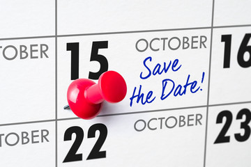 Wall calendar with a red pin - October 15