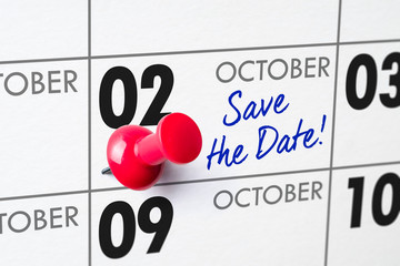 Wall calendar with a red pin - October 02