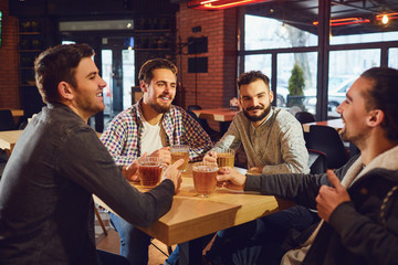 Young people in a meeting in a pub.