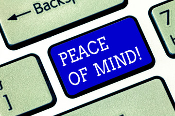 Handwriting text Peace Of Mind. Concept meaning To be peaceful happy with things you have done and accomplish Keyboard key Intention to create computer message pressing keypad idea