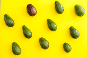 Fresh ripe avocados on color background