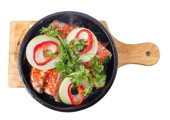 Fried pork ribs with onions and paprika.