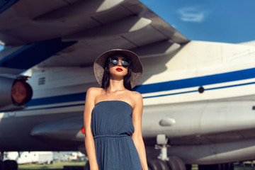 Brunette in a dress at the old airport