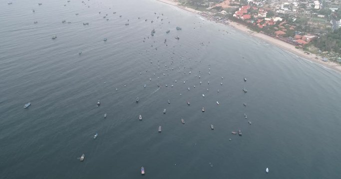 Top view, aerial view from drone. Royalty high quality free stock footage of Mui Ne fishing harbour or fishing village. Mui Ne fishing harbor is a popular tourist destination. Phan Thiet city, Vietnam
