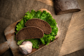 Freshly baked grain brown bread close up still life