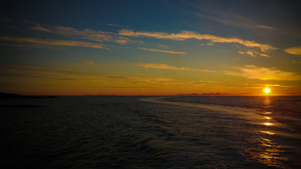 Sunset and sunrise over the sea and Lofoten archipelfgo from the Moskenes - Bodo ferry, Norway