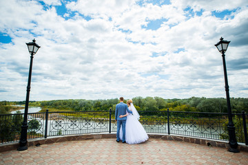 loving couple holding hands looking at the path, symbolizing her future