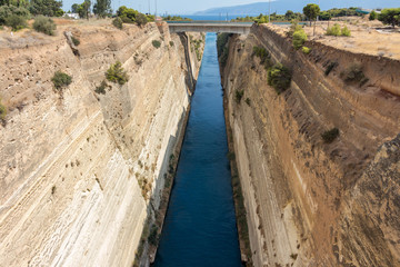 The Corinth Canal connects the Gulf of Corinth with the Saronic Gulf in the Aegean Sea. It separates Peloponnese from the Greek mainland.