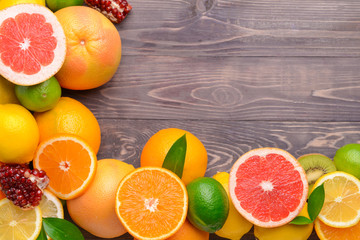 Different fresh fruits on wooden background