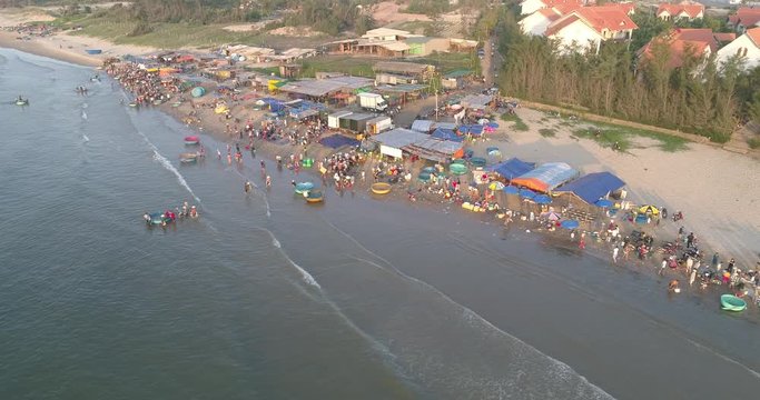 Top view, aerial view from drone. Royalty high quality free stock footage of Mui Ne fishing harbour or fishing village. Mui Ne fishing harbor is a popular tourist destination. Phan Thiet city, Vietnam