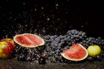 grapes and watermelon in spray of water