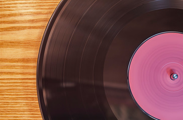Vinyl record is played on a vintage turntable