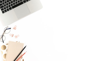 Border frame made of laptop, notepads, glasses and stationery on white background