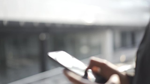 Young man using apps on a touchscreen smartphone - Concept for using technology, shopping online, using mobile apps, texting, phone addiction.