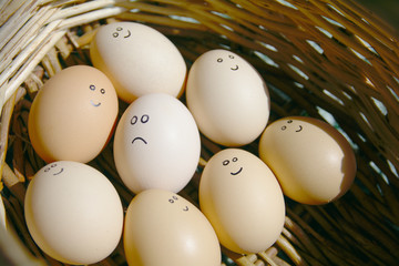 Self Made Hand Drawn - Group of emotional eggs. They are in a basket .
