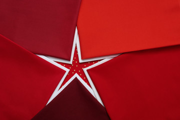 Fat quarters of fabrics red and white colors lying in the shape like a star