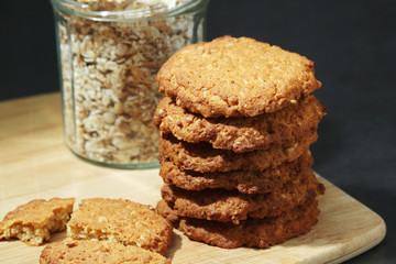Homemade oatmeal cookie at dark background