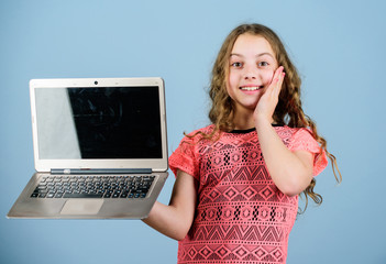 Blogging concept. Girl with laptop computer. Little child using pc. Digital technology. Surfing...