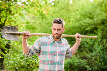 sexy farmer hold shovel. Eco farm worker. Harvest. happy earth day. Eco living. farming and agriculture cultivation. Garden tools. muscular ranch man. Plants need good care