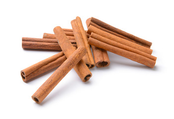 Aromatic cinnamon sticks on white background