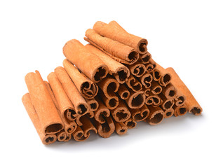 Aromatic cinnamon sticks on white background