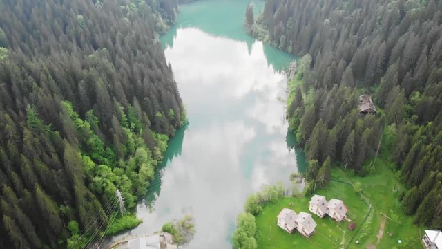 Aerial shot of Scropoasa lake at daylight. Bucegi Mountains, Romania