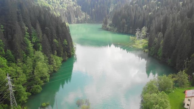 Aerial shot of Scropoasa lake at daylight. Bucegi Mountains, Romania