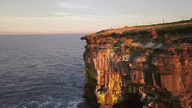 AERIAL PARALLAX Revealing stunning rock shelters under Carrowmore Lacken cliff at sunset