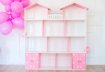 Doll houses in the children's room, furniture for children in the interior of the children's room