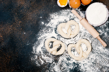 raw pretzel on a floor ready to be baked and ingredients