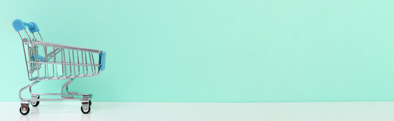Empty shopping cart banner on light blue background