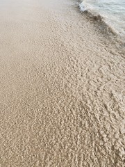 Beautiful tropical beach view with white sand and blue sea with white wave  on Phuket, Thailand. Minimal composition with neutral colors. Summer and travel concept.