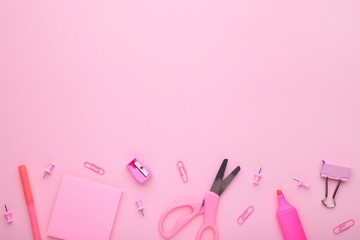 Pink school accessories on pink background. Back to school concept, minimalism