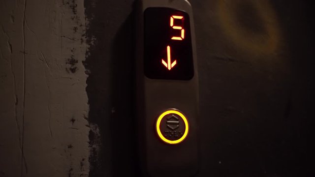 Video recording of a digital counter from ten to zero of a descent of a lith in a building. Modern light, countdown.