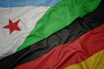 waving colorful flag of germany and national flag of djibouti.