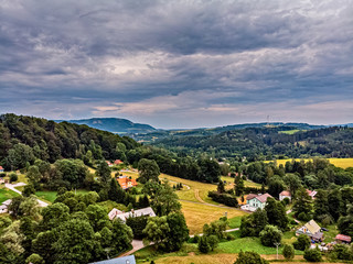 Fields, meadows and thick rain clouds over the countryside in the Czech Republic