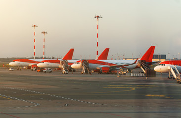 Many passenger planes in the airport.