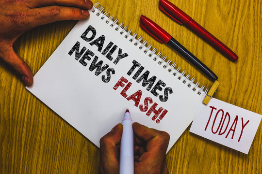 Writing note showing Daily Times News Flash. Business photo showcasing fast response to actions happened in article way Man holding marker notebook clothepin reminder wooden table cup coffee