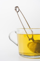 A cup of Chamomile tea in a clear glass mug