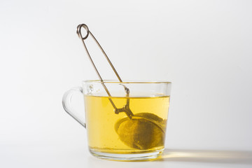 A cup of Chamomile tea in a clear glass mug