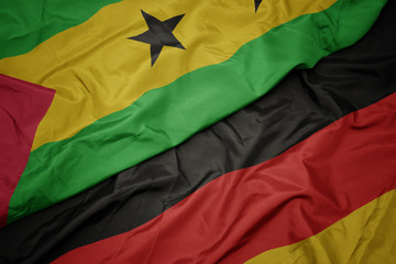 waving colorful flag of germany and national flag of sao tome and principe.