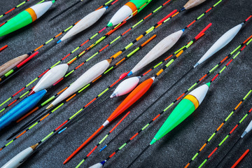 different in length , color and appearance fishing floats on the table © OlegDoroshin