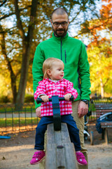 little girl on a swing